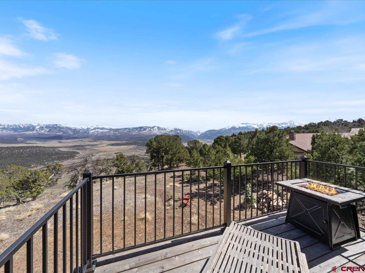 810 Pine Drive Ridgway, CO 81432 - Photo 31 of 36 a view of a balcony with wooden floor and iron fence