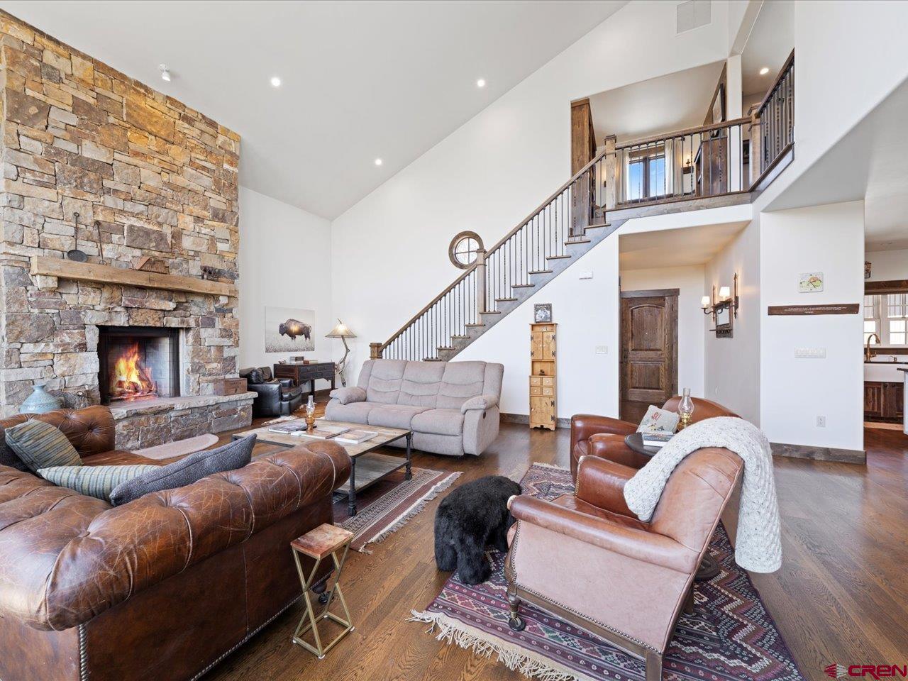 810 Pine Drive Ridgway, CO 81432 - Photo 9 of 36 a living room with furniture or couch and a fireplace