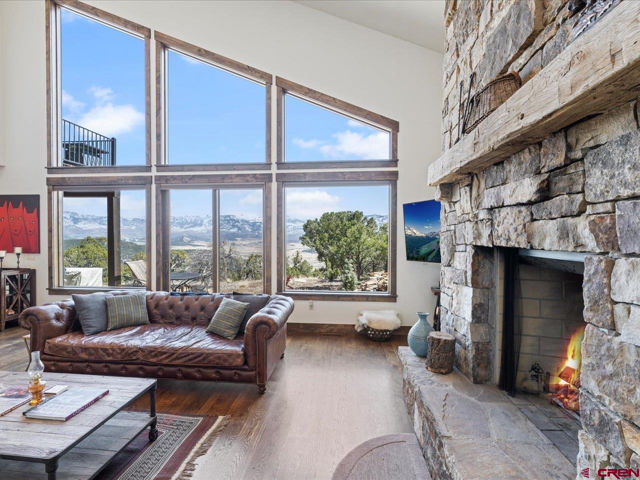 810 Pine Drive Ridgway, CO 81432 - Photo 10 of 36 a living room with furniture and a large window