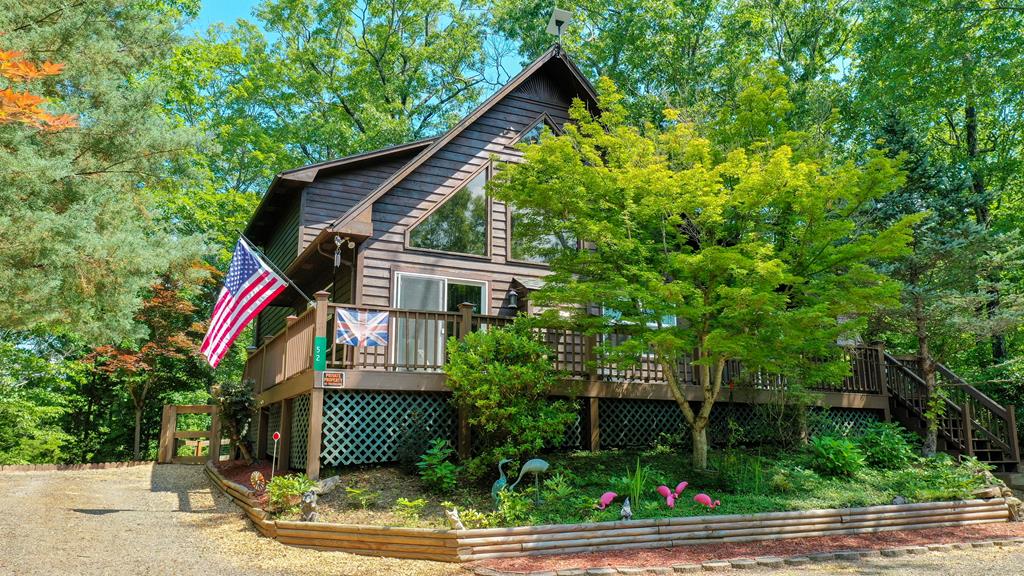 front view of a house with a tree