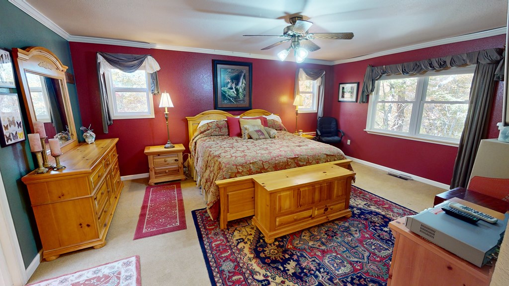 52 Bear Track Road Andrews, NC 28901 - Photo 22 of 38 a bed room with a bed and a window