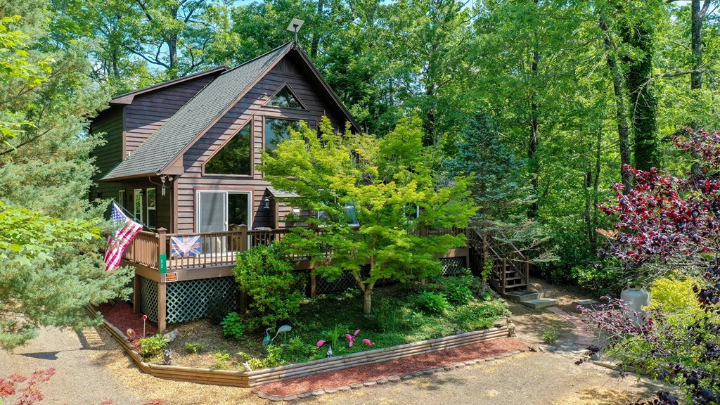 52 Bear Track Road Andrews, NC 28901 - Photo 33 of 38 a front view of a house with a yard garage and outdoor seating