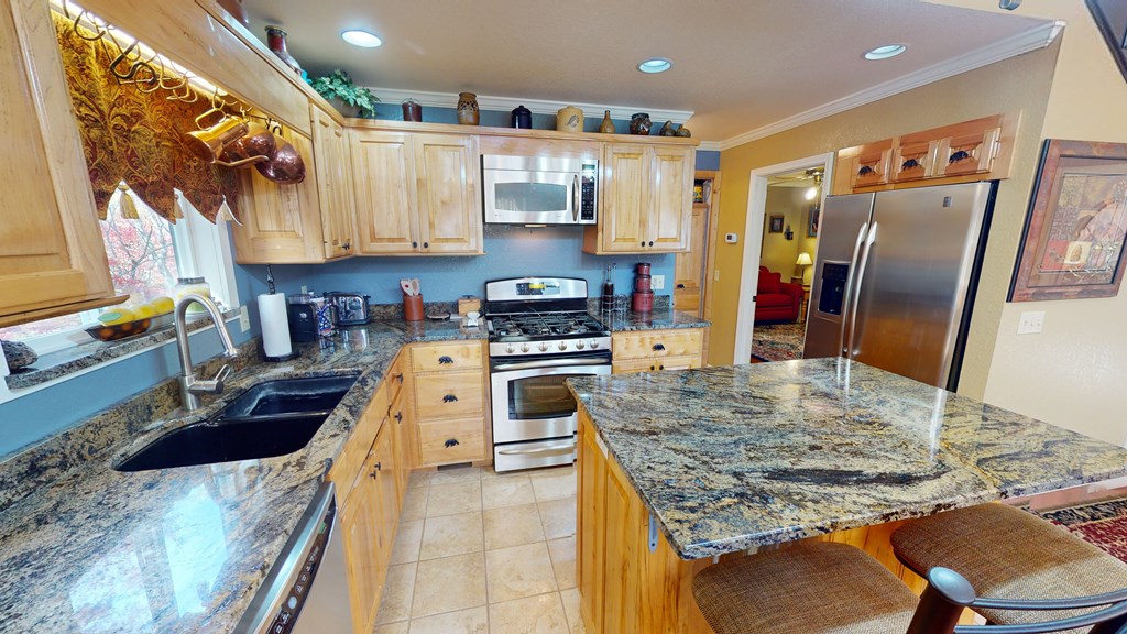 52 Bear Track Road Andrews, NC 28901 - Photo 8 of 38 a kitchen with stainless steel appliances granite countertop a sink stove and refrigerator