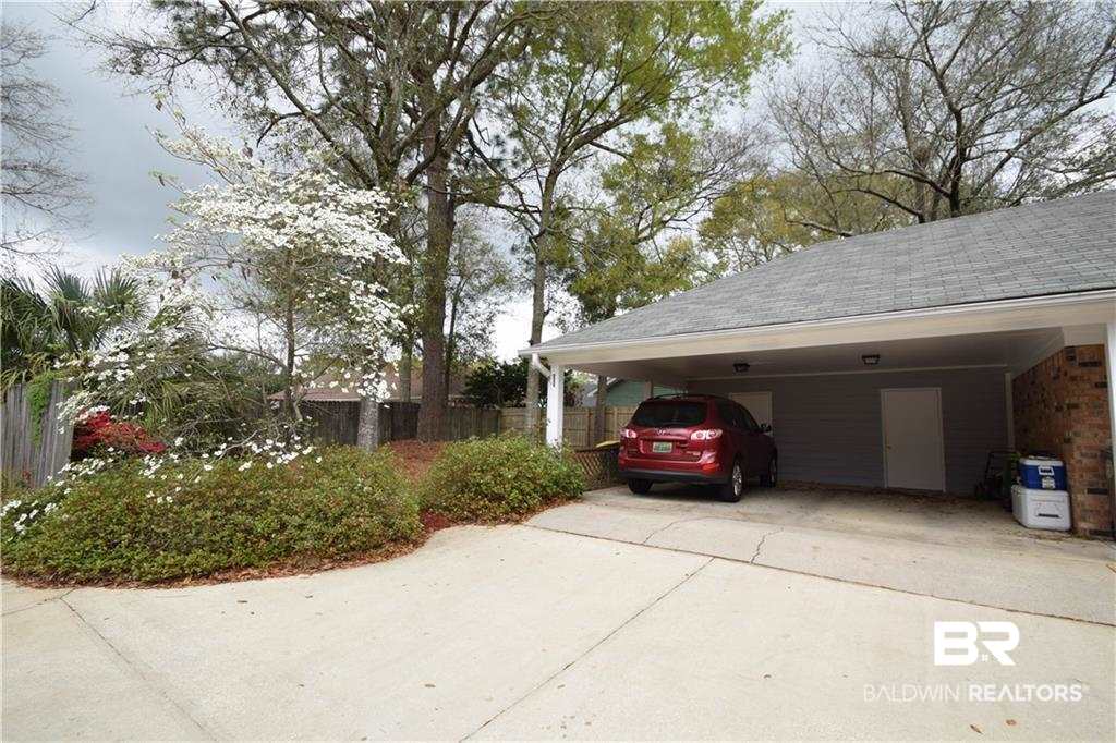 852 West Briar Court Mobile, AL 36609 - Photo 29 of 40 Double carport with lots of storage attached.