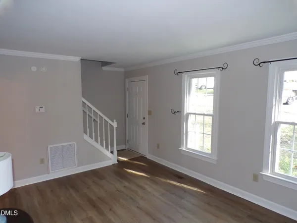 a kitchen with stainless steel appliances wooden cabinets and a stove top oven