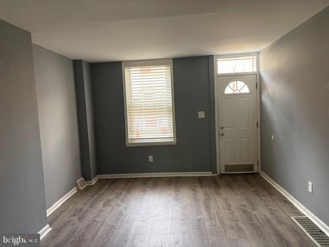 532 Dudley Street Philadelphia, PA 19148 - Photo 4 of 14 an empty room with wooden floor and windows