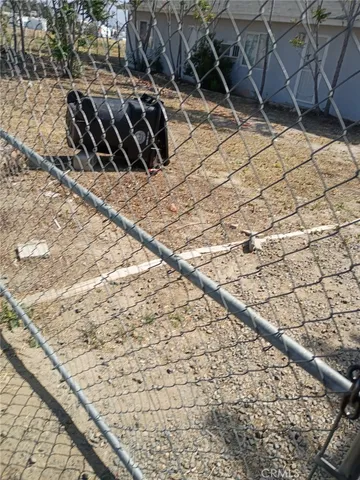 a view of a backyard of the house