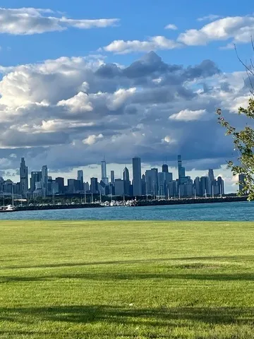 a view of a swimming pool and an outdoor seating