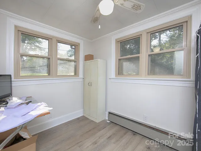 a kitchen with stainless steel appliances granite countertop a sink and a window