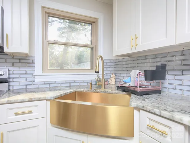 a dinning room with furniture a window and outdoor view