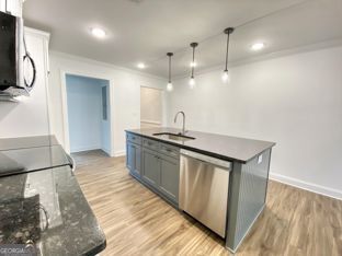 1333 Mooty Bridge Road, Unit 2 LaGrange, GA 30240 - Photo 4 of 17 a kitchen with a sink a refrigerator and wooden floor