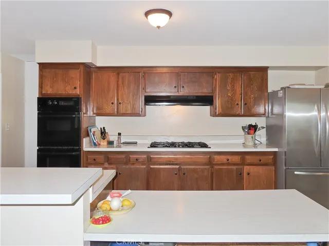 a kitchen with a sink and a stove