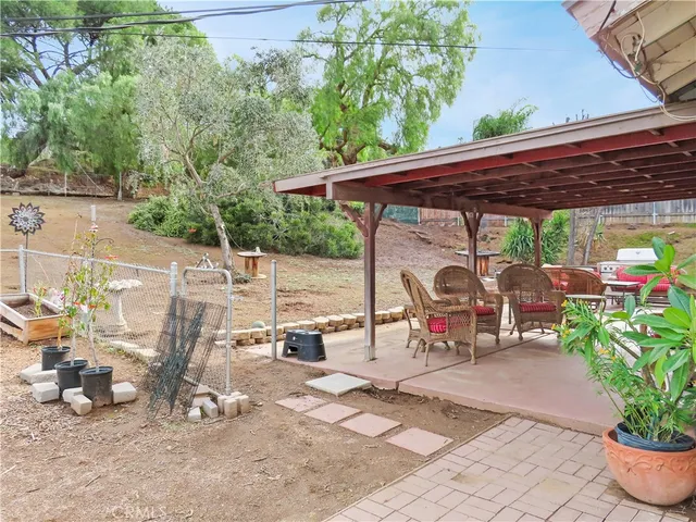 a patio with table and chairs
