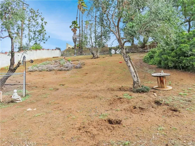 a view of a wooden door with a bench