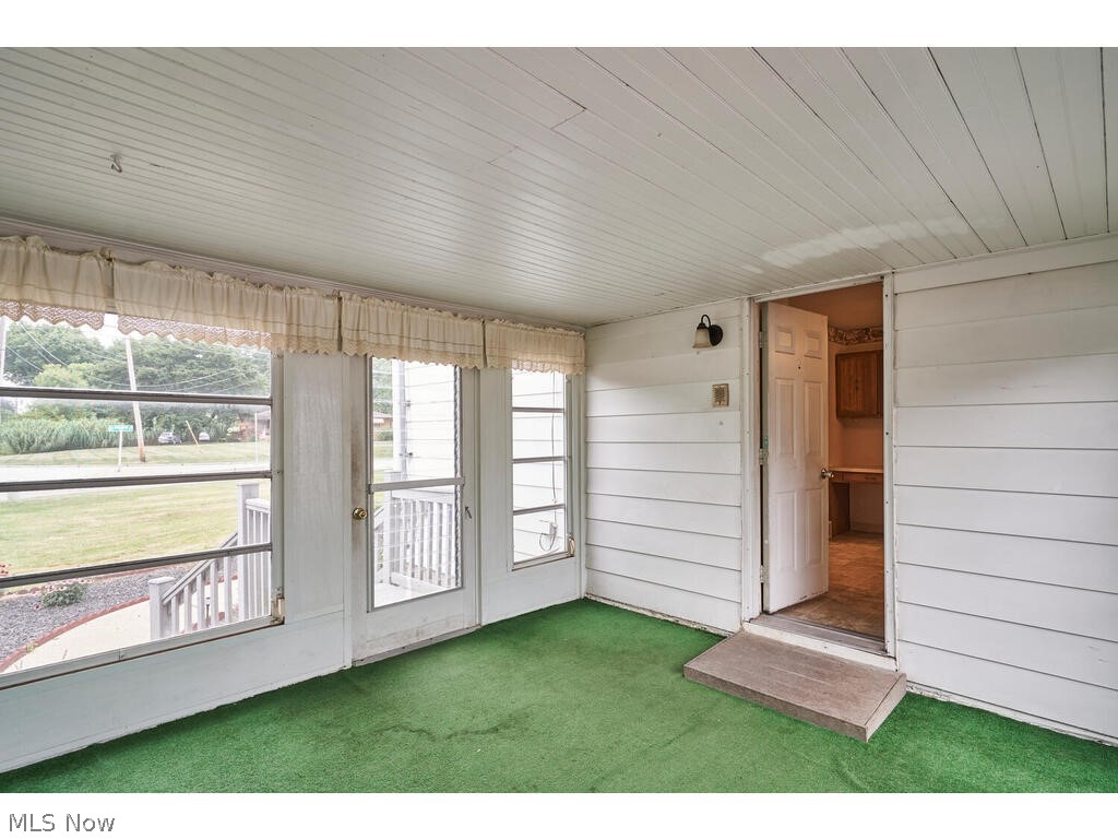 2963 Ridgewood Road Fairlawn, OH 44333 - Photo 24 of 30 Breezeway leads to deck and gorgeous 1.42 acres with city water and sewer
