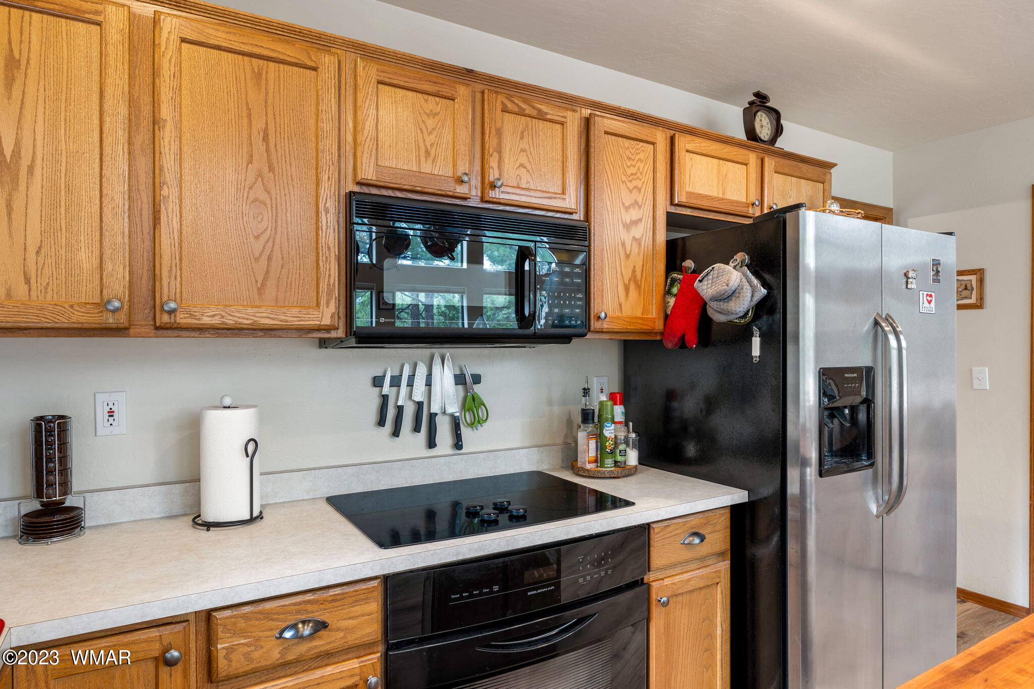 2231 Del Rio Circle Overgaard, AZ 85933 - Photo 12 of 36 a kitchen with stainless steel appliances granite countertop a refrigerator and a stove top oven