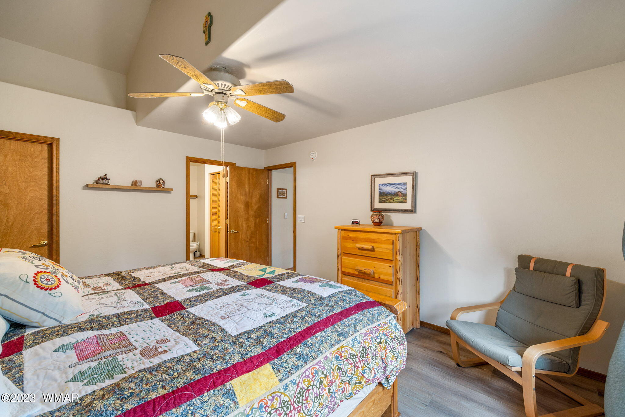 2231 Del Rio Circle Overgaard, AZ 85933 - Photo 14 of 36 a bedroom with a bed and wooden floor