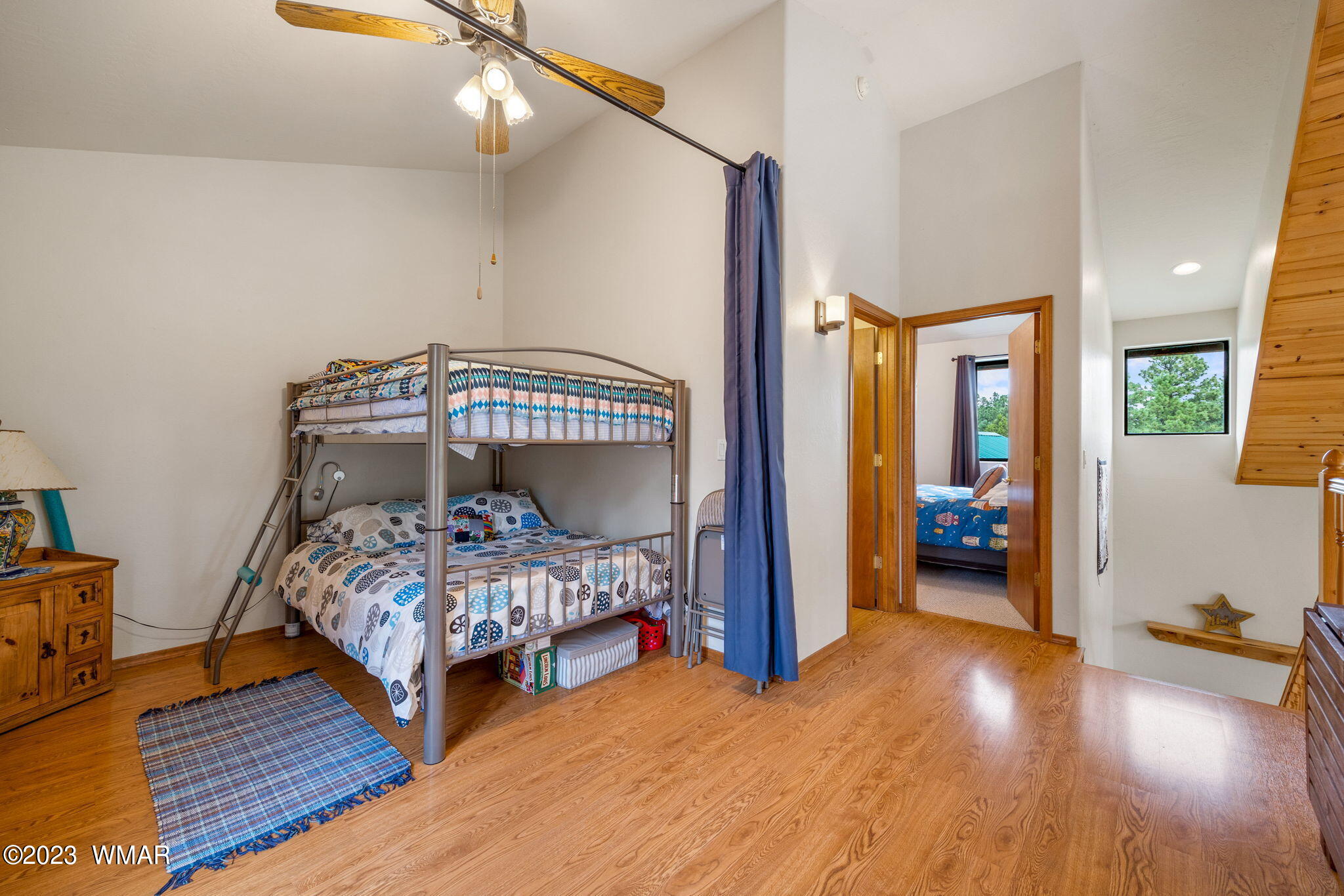 2231 Del Rio Circle Overgaard, AZ 85933 - Photo 18 of 36 a bedroom with two beds and wooden floor