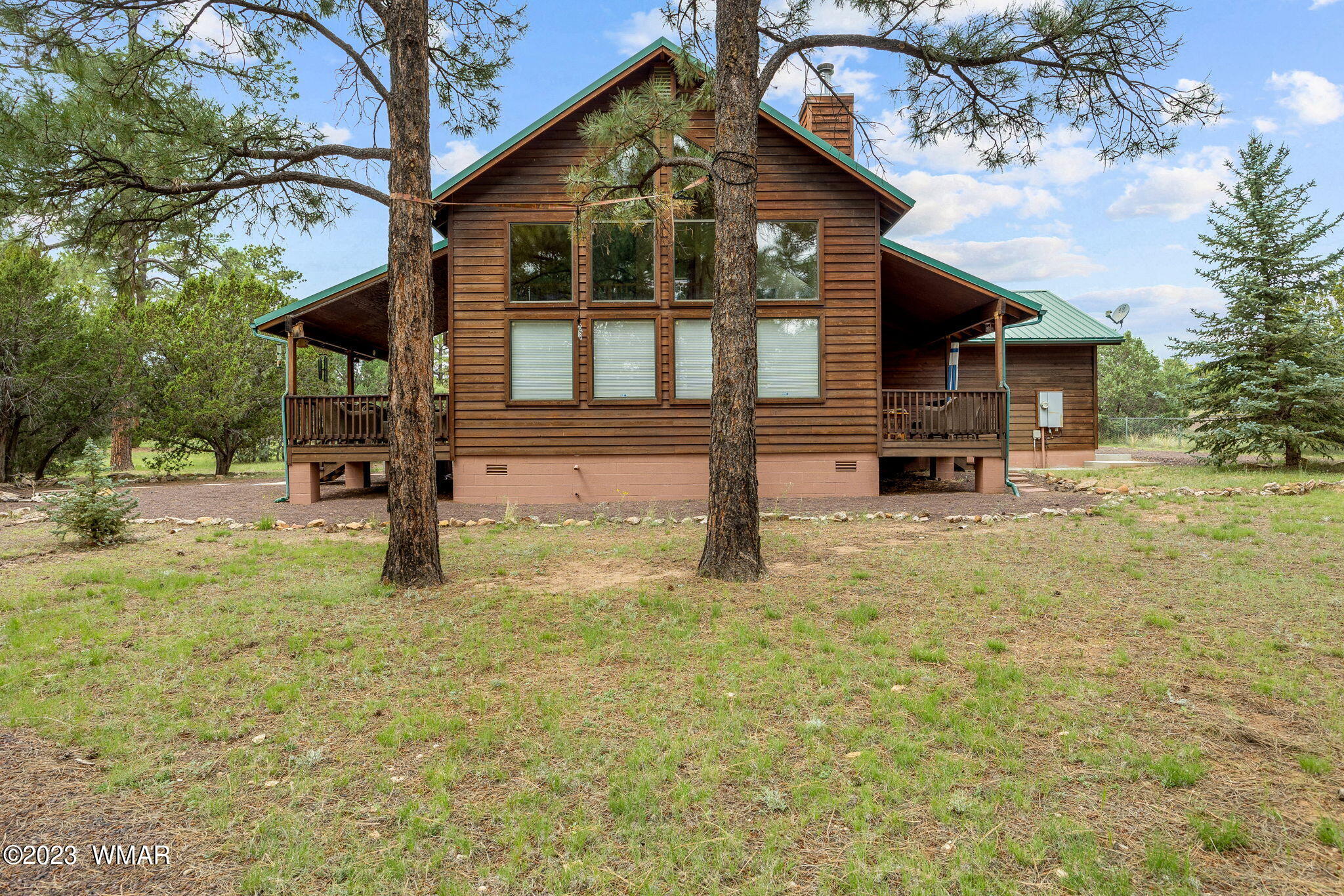 2231 Del Rio Circle Overgaard, AZ 85933 - Photo 2 of 36 a view of an house with backyard and trees