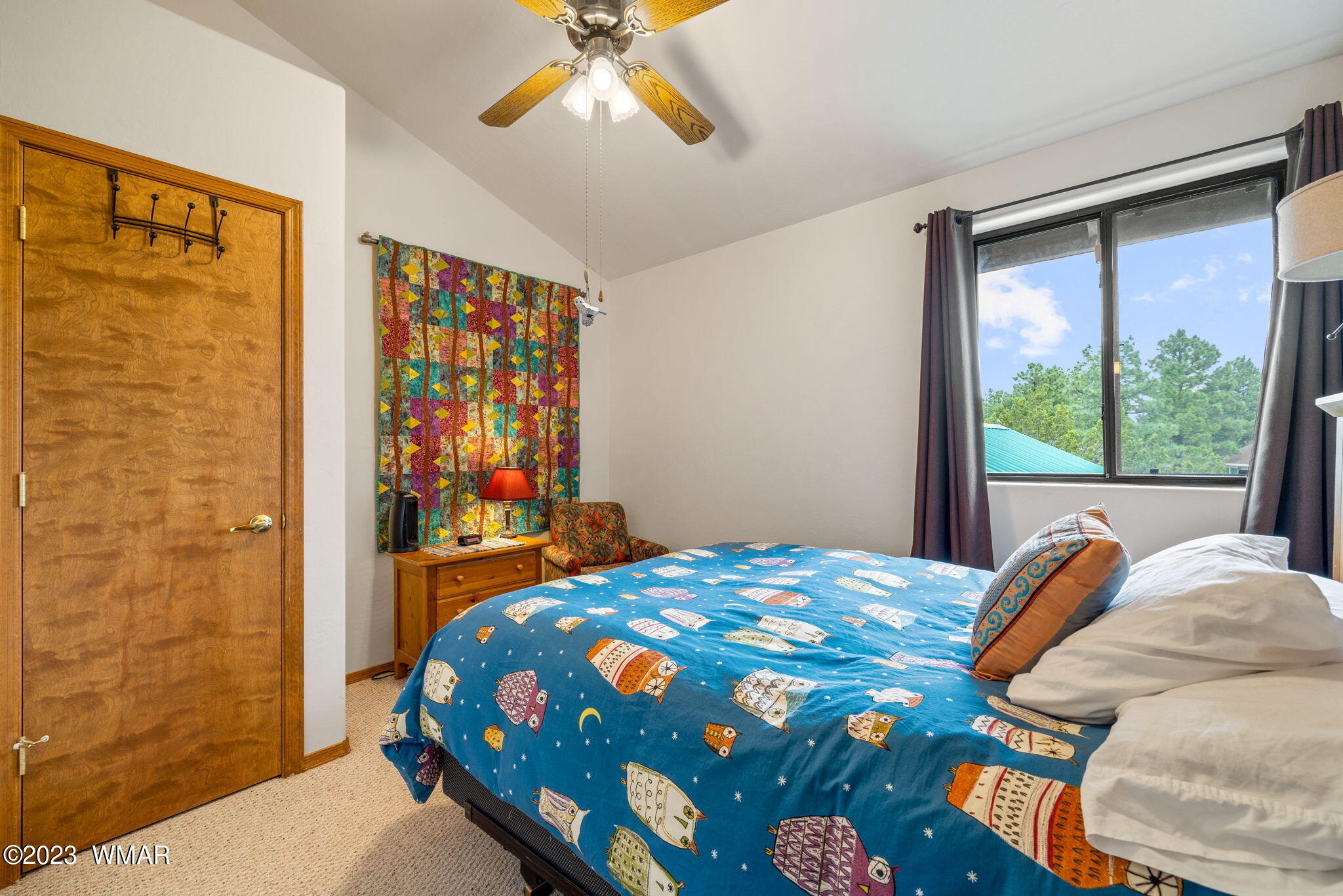 2231 Del Rio Circle Overgaard, AZ 85933 - Photo 21 of 36 a bedroom with a bed and a window