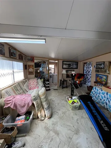 a room with lots of furniture and a window