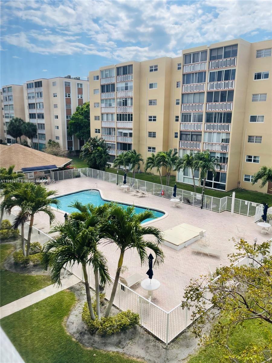 620 Northeast 12th Avenue, Unit 406 Hallandale Beach, FL 33009 - Photo 2 of 11 a view of a building and outdoor space