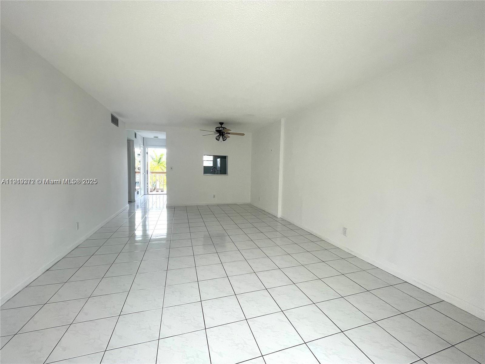 620 Northeast 12th Avenue, Unit 406 Hallandale Beach, FL 33009 - Photo 5 of 11 a view of an empty room and window