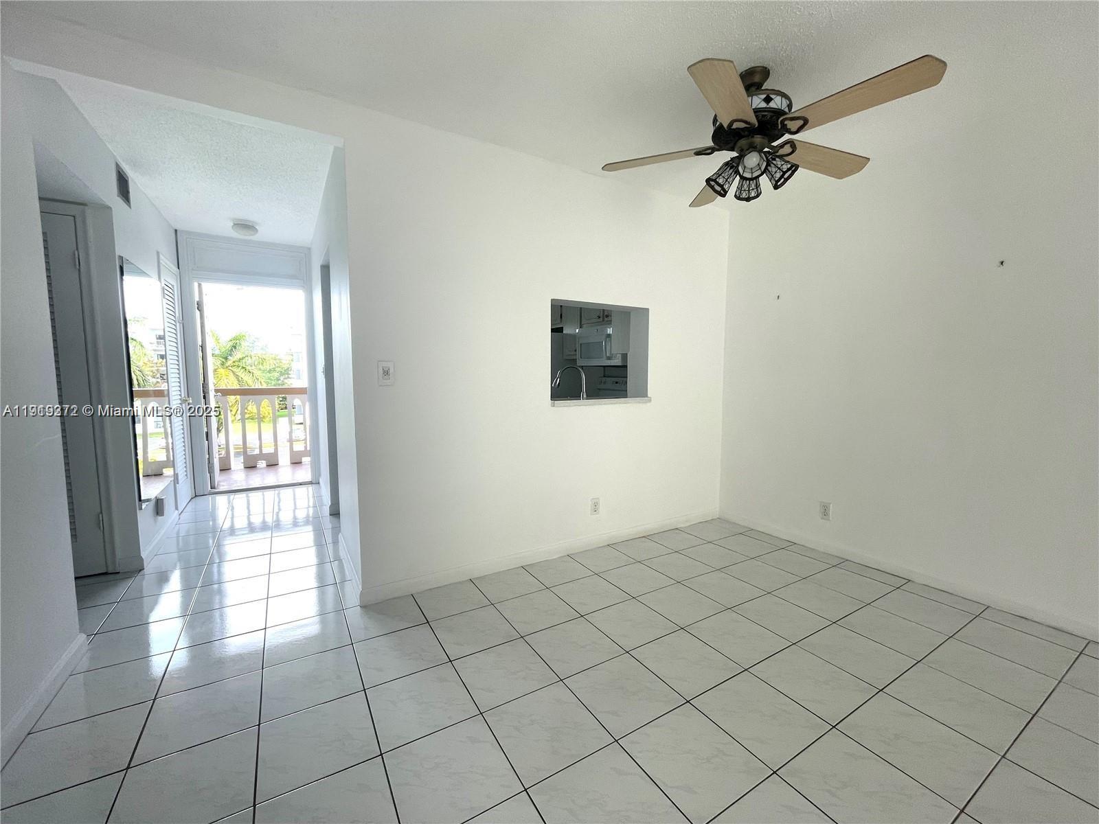 620 Northeast 12th Avenue, Unit 406 Hallandale Beach, FL 33009 - Photo 6 of 11 a view of an empty room and window