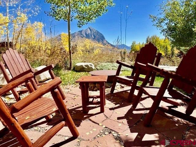450 Meridian Lake Drive Crested Butte, CO 81224 - Photo 20 of 45 a view of a chairs and table in the patio