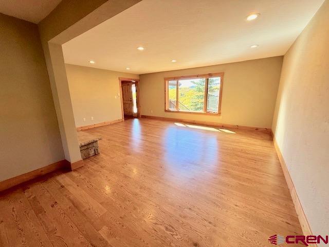450 Meridian Lake Drive Crested Butte, CO 81224 - Photo 25 of 45 an empty room with wooden floor and windows