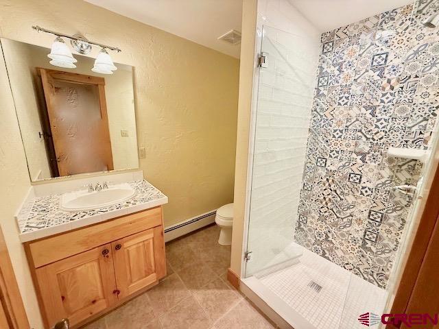450 Meridian Lake Drive Crested Butte, CO 81224 - Photo 30 of 45 a bathroom with a granite countertop sink and a mirror
