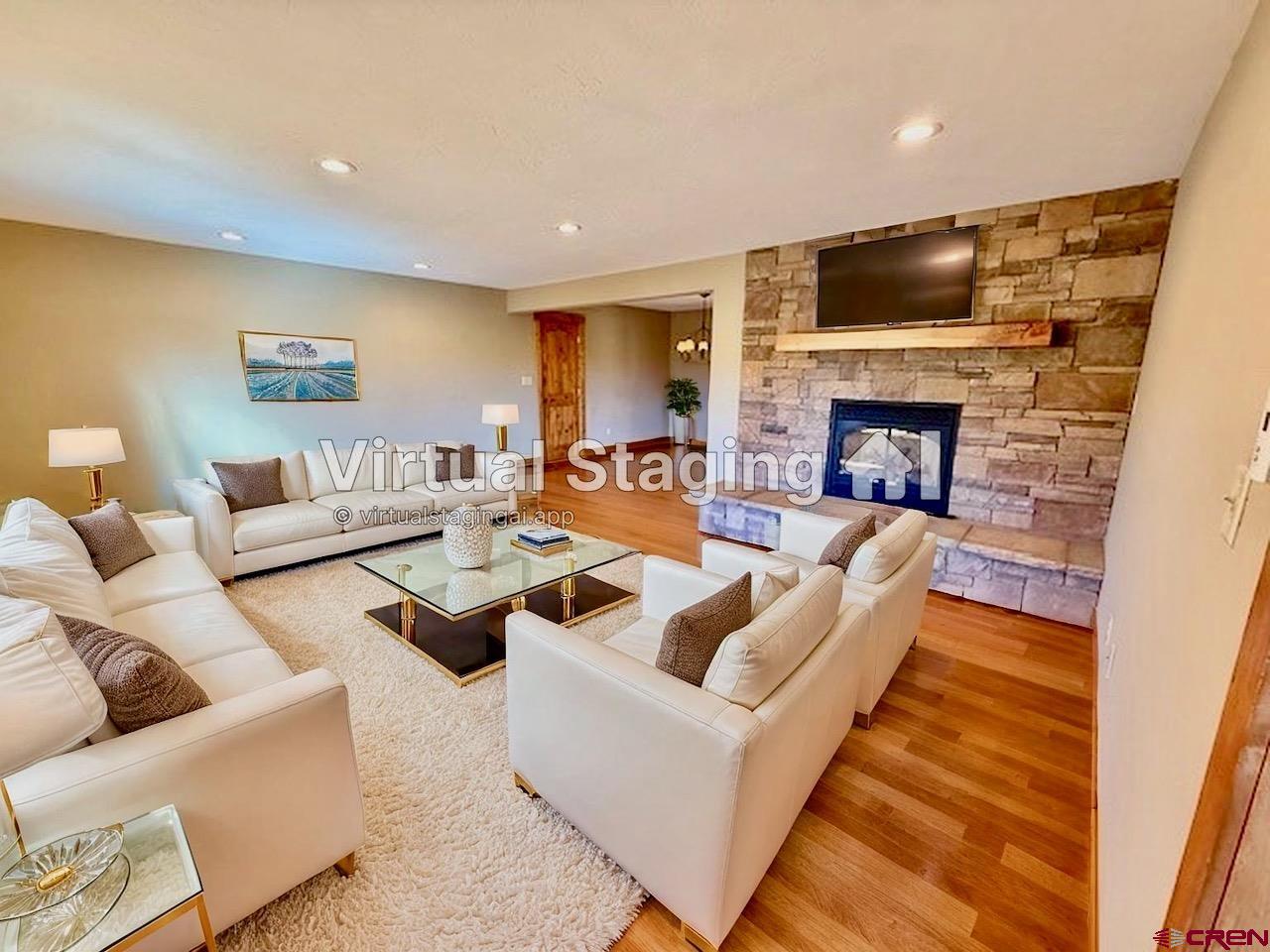 450 Meridian Lake Drive Crested Butte, CO 81224 - Photo 3 of 45 a living room with furniture and a fireplace