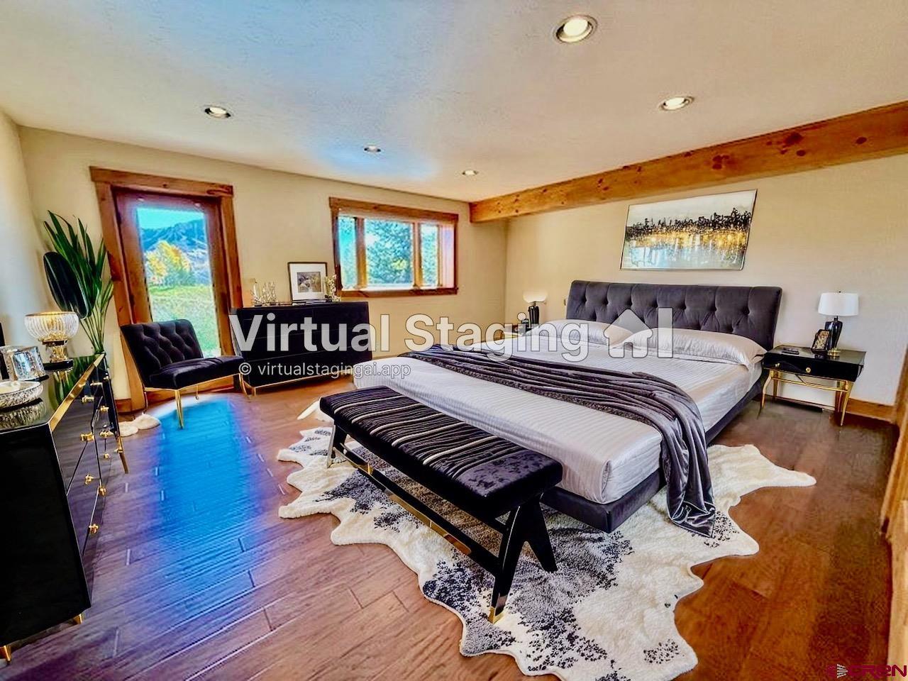 450 Meridian Lake Drive Crested Butte, CO 81224 - Photo 36 of 45 a bedroom with furniture and a wooden floor