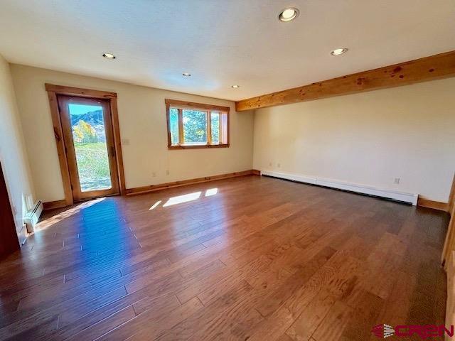 450 Meridian Lake Drive Crested Butte, CO 81224 - Photo 37 of 45 an empty room with wooden floor and windows