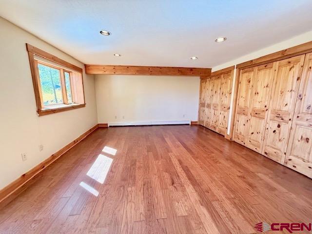 450 Meridian Lake Drive Crested Butte, CO 81224 - Photo 39 of 45 wooden floor in an empty room with a window