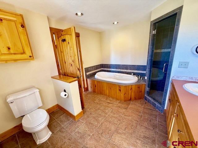 450 Meridian Lake Drive Crested Butte, CO 81224 - Photo 41 of 45 a bathroom with a sink toilet and shower