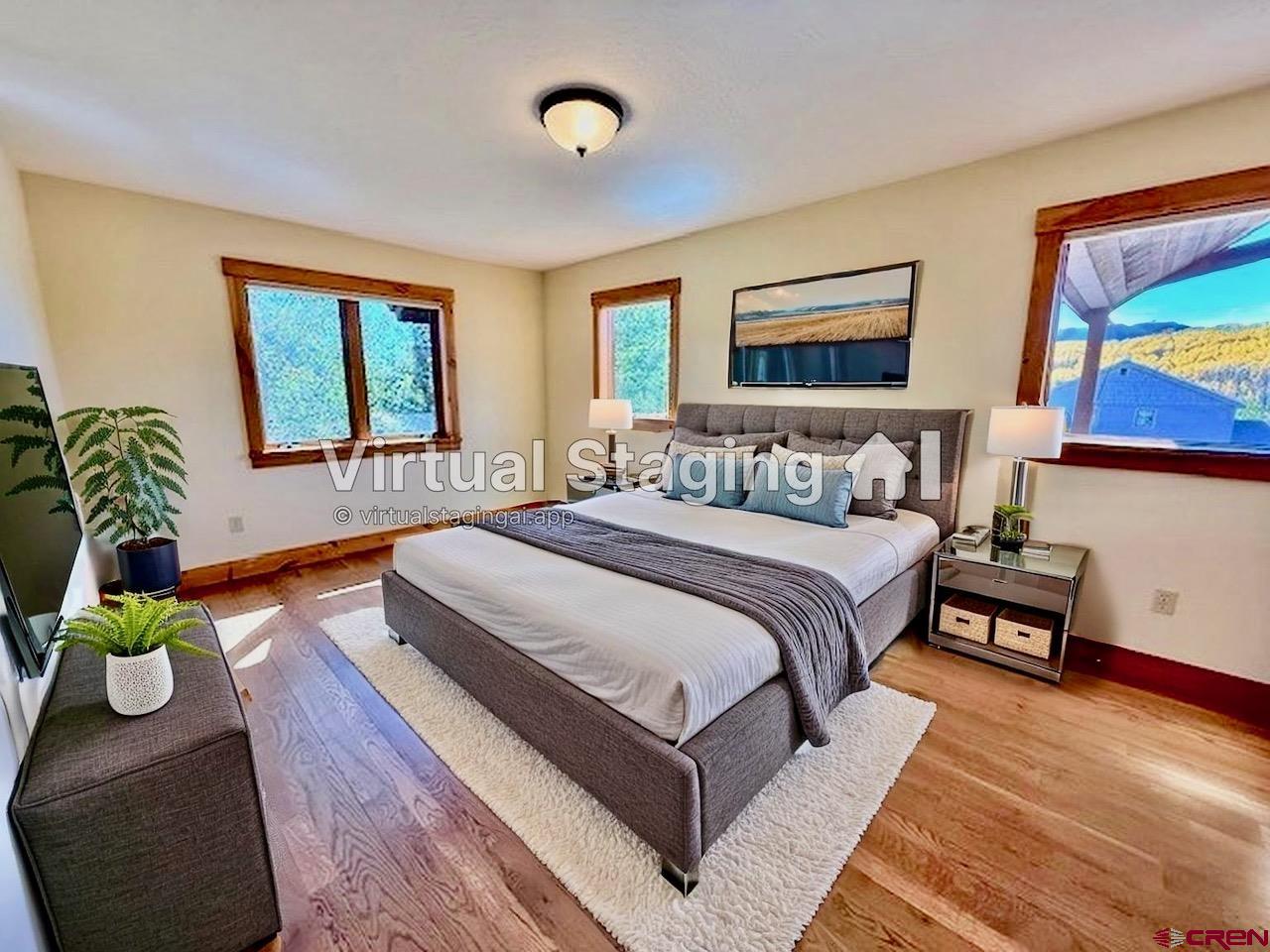 450 Meridian Lake Drive Crested Butte, CO 81224 - Photo 42 of 45 a bedroom with bed and a couch