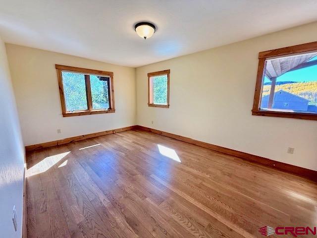 450 Meridian Lake Drive Crested Butte, CO 81224 - Photo 43 of 45 a view of an empty room with window and wooden floor