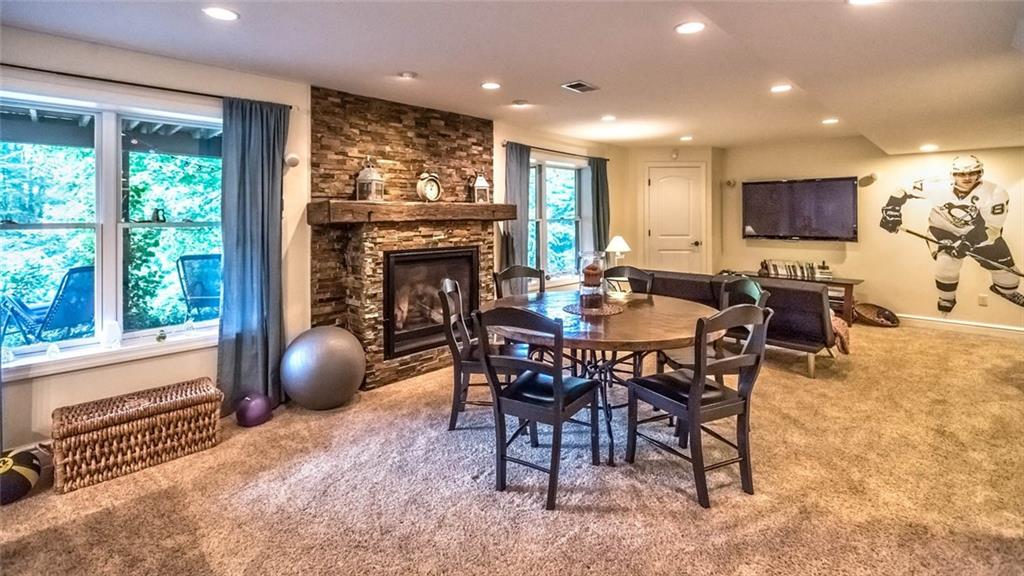 183 Davidson Road Mars, PA 16046 - Photo 11 of 25 The professionally finished gameroom just flows on and on and on.....With the same stacked stone highlights on the gas fireplace and the surround sound speakers, this is the gameroom you have been searching for!