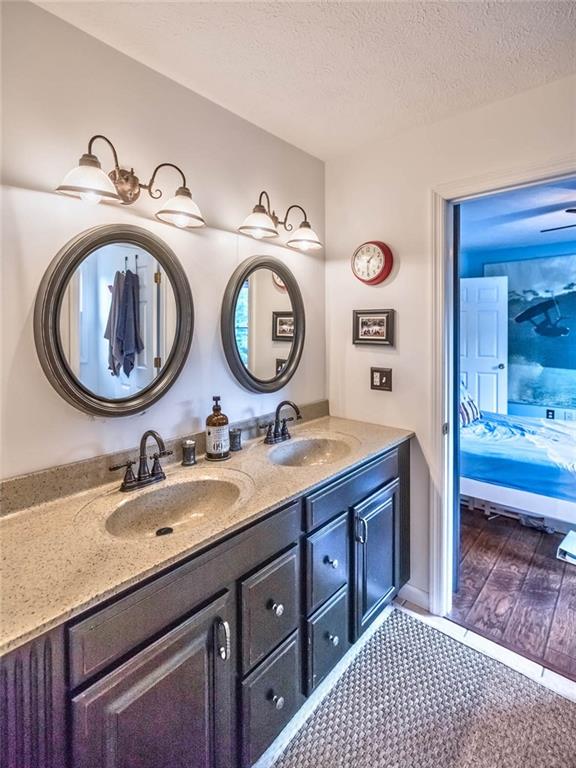 183 Davidson Road Mars, PA 16046 - Photo 19 of 25 Dual vanities with ceramic tile flooring and standard size combination tub/shower.