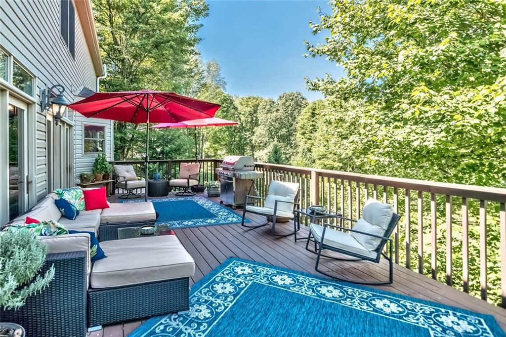 183 Davidson Road Mars, PA 16046 - Photo 22 of 25 The deck flows the majority of the back of the home and wraps around to the side entry garage (over 32 x 14 ft in size) and what a view!!