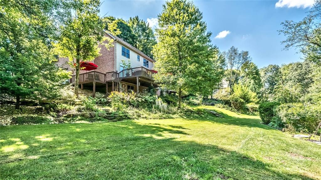 183 Davidson Road Mars, PA 16046 - Photo 25 of 25 Sellers leveled off a huge section in their back yard for a wonderful space for soccer/entertainment, etc....There are then walking trails down into the woods. The landscape stones are used as steps to the patio - Nice!
