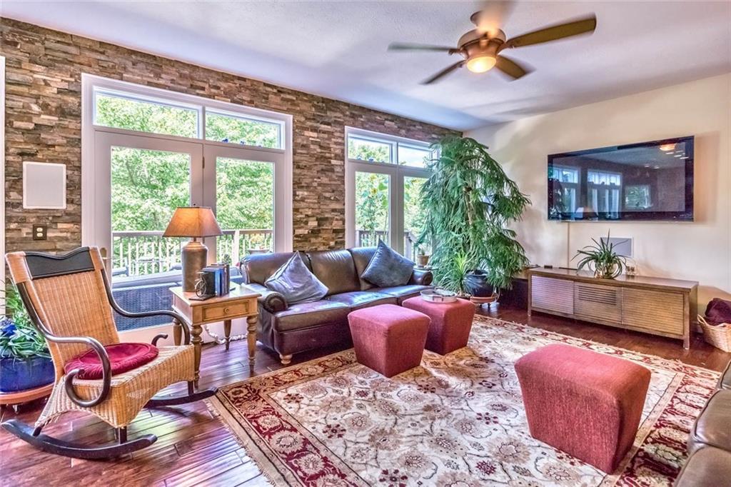 183 Davidson Road Mars, PA 16046 - Photo 6 of 25 Gorgeous engineered hardwood flooring, transom window accents, and the stacked stone wall bring out all of natures beauty in this open and flowing familyroom with built-in speakers.