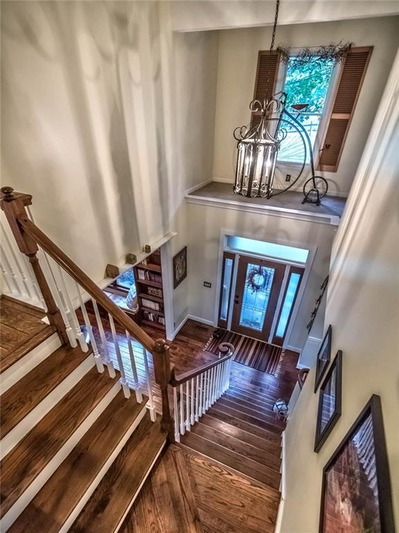183 Davidson Road Mars, PA 16046 - Photo 10 of 25 Modern 2 story light fixture and turned front staircase with exposed wood treads. There is a 2nd back staircase leading to the bedrooms on the East wing as well!