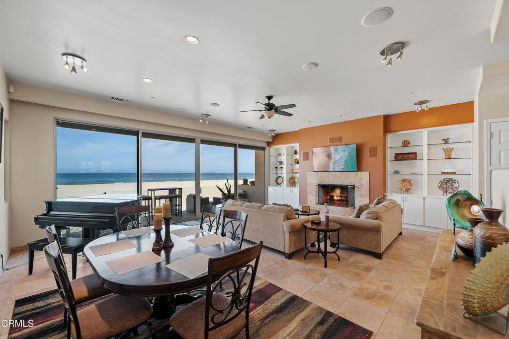 791 Mandalay Beach Road Oxnard, CA 93035 - Photo 14 of 46 a living room with fireplace furniture and a large window