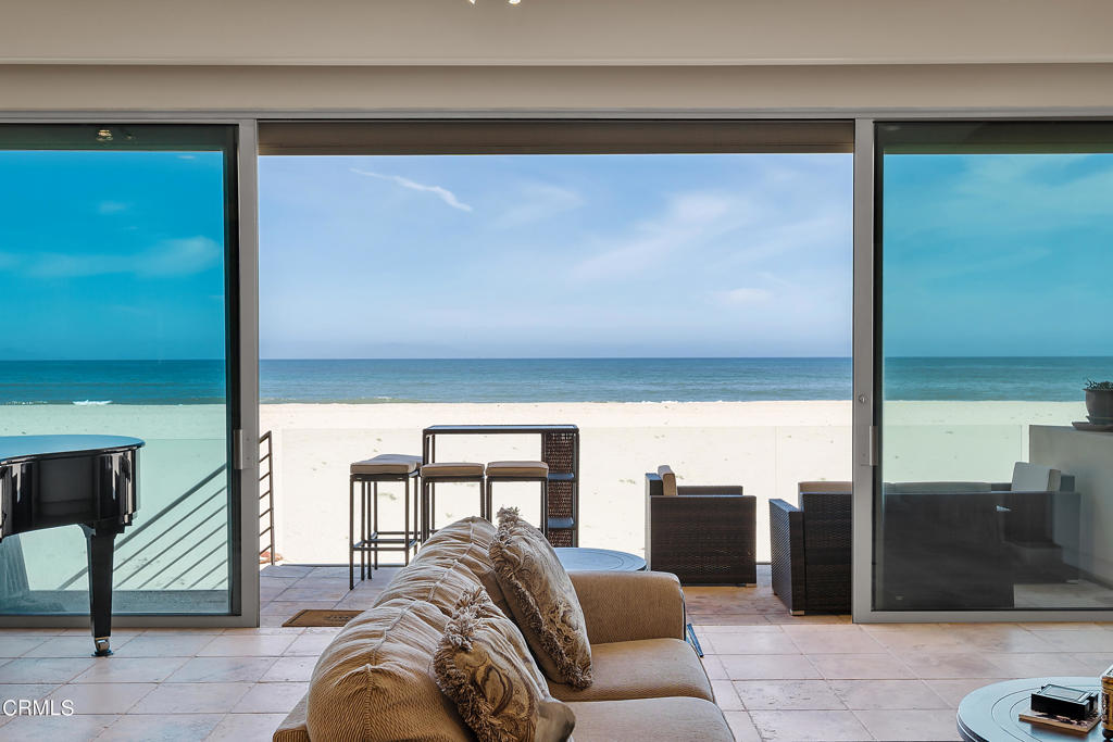 791 Mandalay Beach Road Oxnard, CA 93035 - Photo 15 of 46 a living room with furniture and a floor to ceiling window