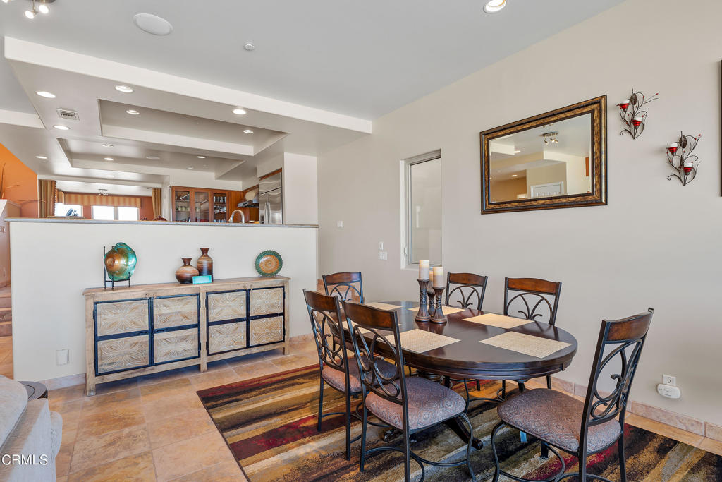 791 Mandalay Beach Road Oxnard, CA 93035 - Photo 16 of 46 a view of a dining room with furniture and lots of wooden floor