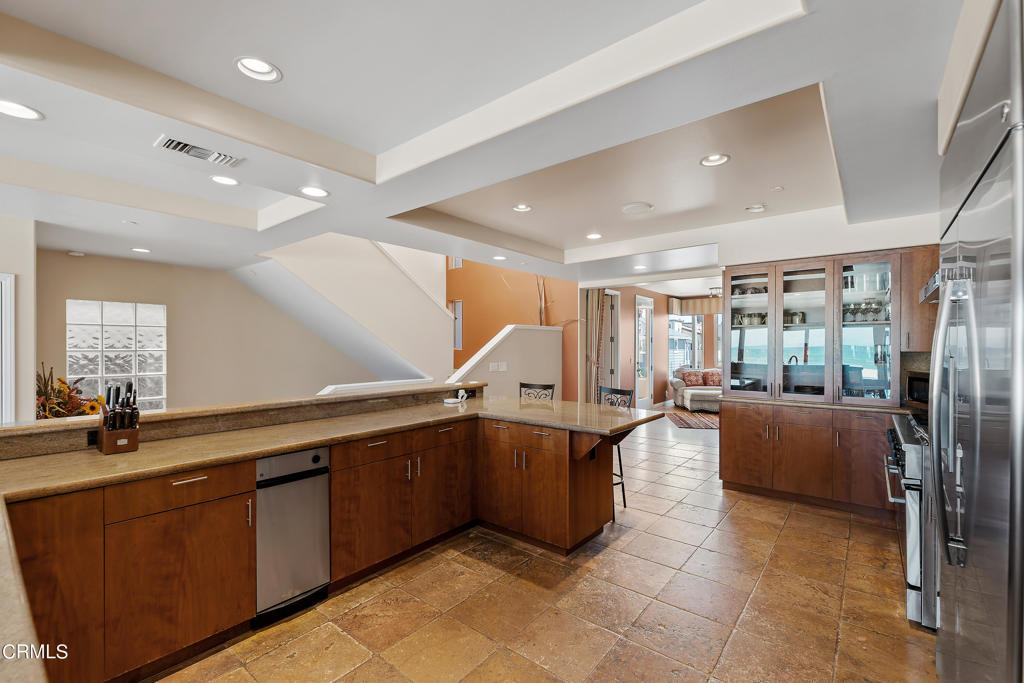 791 Mandalay Beach Road Oxnard, CA 93035 - Photo 17 of 46 a large kitchen with stainless steel appliances lots of counter top space