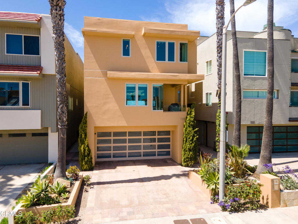 791 Mandalay Beach Road Oxnard, CA 93035 - Photo 2 of 46 a front view of a building with a yard