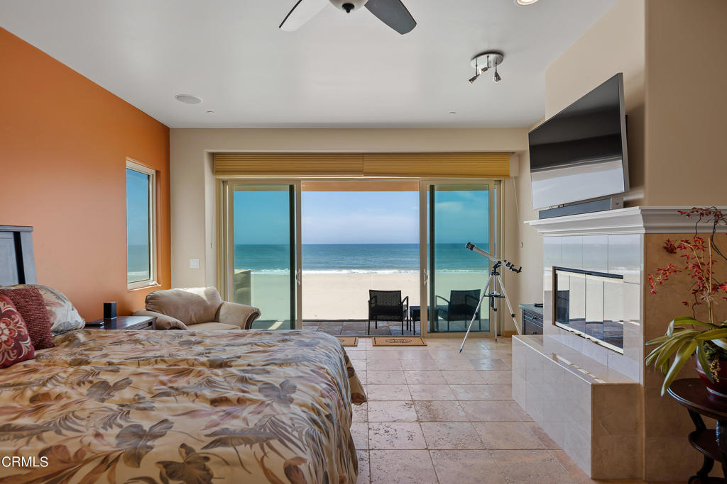 791 Mandalay Beach Road Oxnard, CA 93035 - Photo 27 of 46 a bedroom with a large bed and a large window